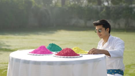 Indian-man-looking-at-Gulal-holi-colors