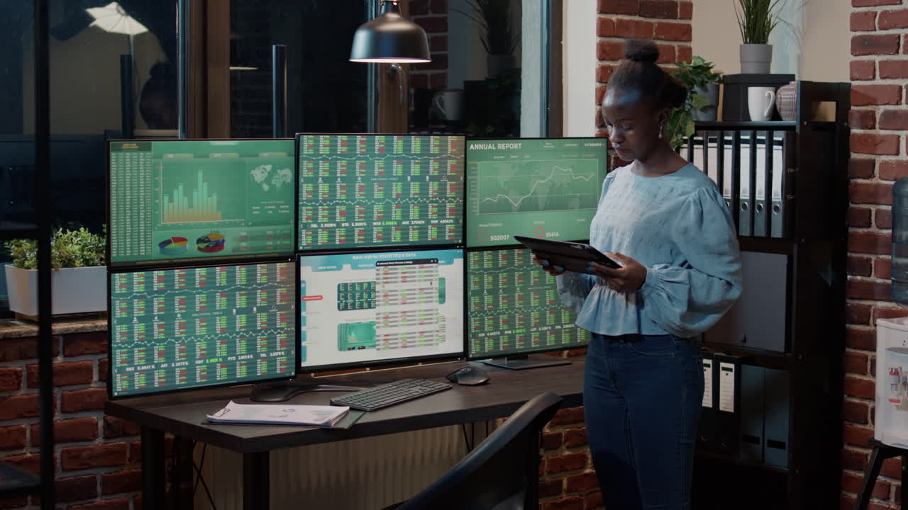 Trade broker using digital tablet to analyze forex stock market