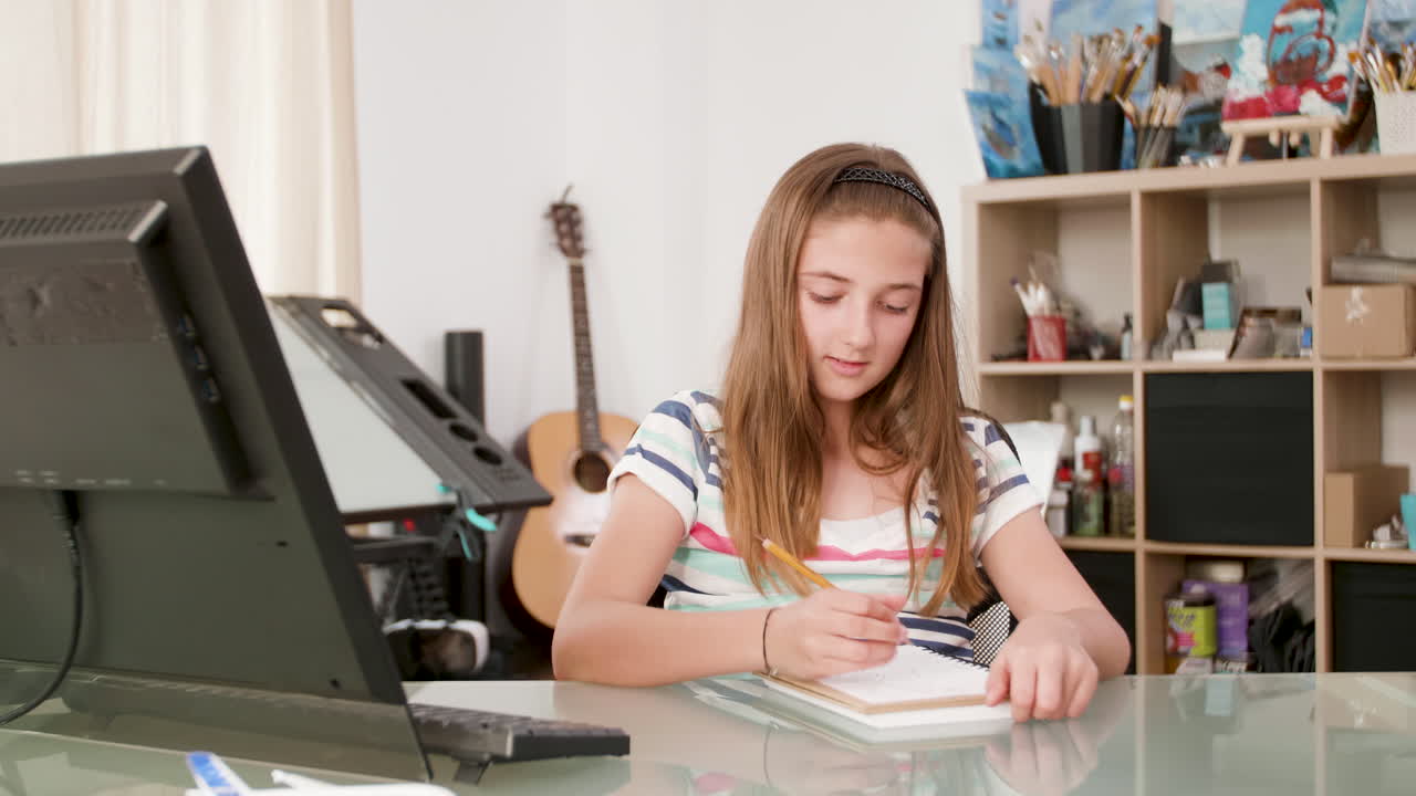 Girl drawing in her art studio
