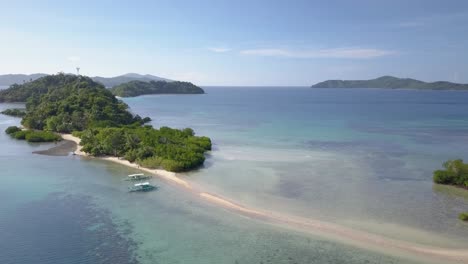 Aerial-view-of-island-with-mangrove-and-long-sandbar-in-the-Philippines---camera-pedestal-down