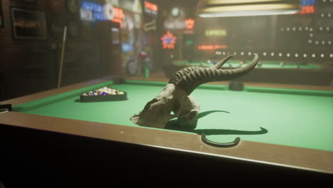 pool table with bull skull and colorful bar decorations in a dimly lit room