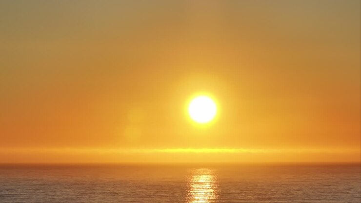 Picturesque Landscape Of Sunset Shining Over The Sea