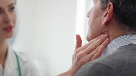 Handheld-view-of-senior-man-during-routine-examination-at-the-doctor