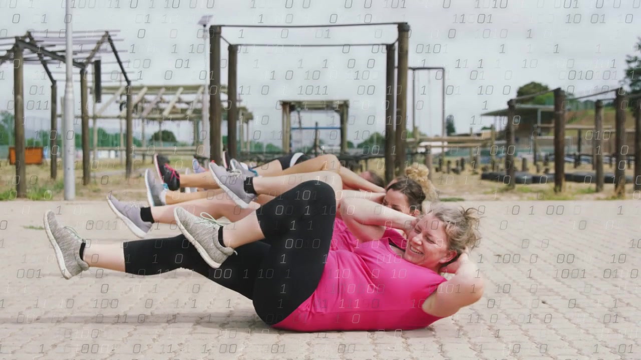 Lead woman pink starting bike crunch group syncing pedaling twisting binary overlay showing fitness