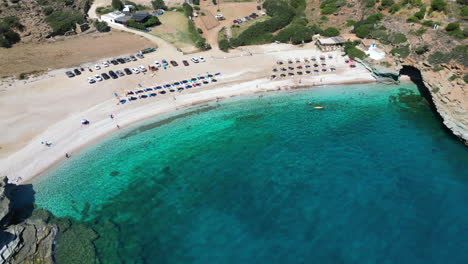 Aerial-drone-video-of-iconic-turquoise-and-sapphire-bay-and-beach-of-Andros,-Cyclades,-Greece