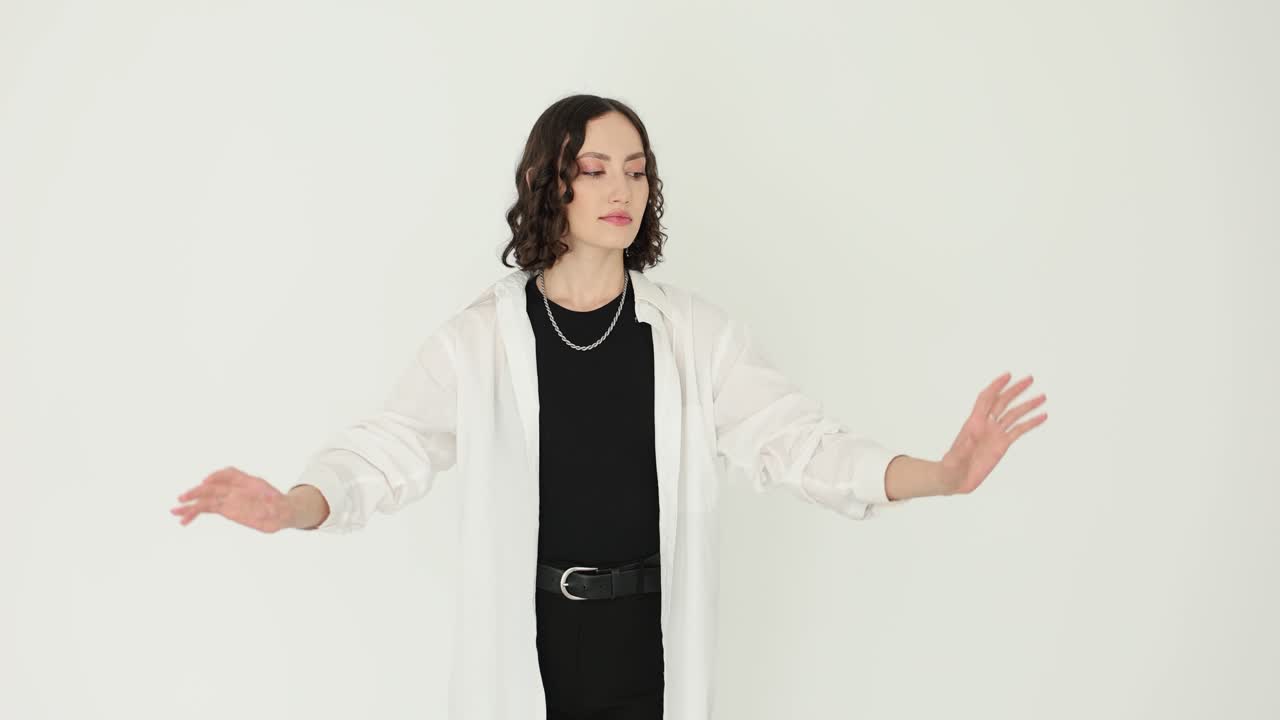 Stylish Young Woman Posing in White Shirt and Black Outfit
