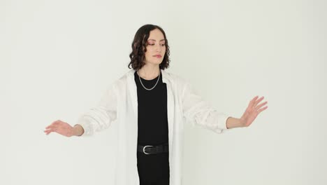stylish young woman posing in white shirt and black outfit