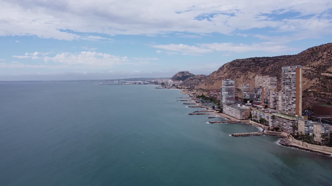 Aerial View of Coastal City with Buildings on a Cliffside