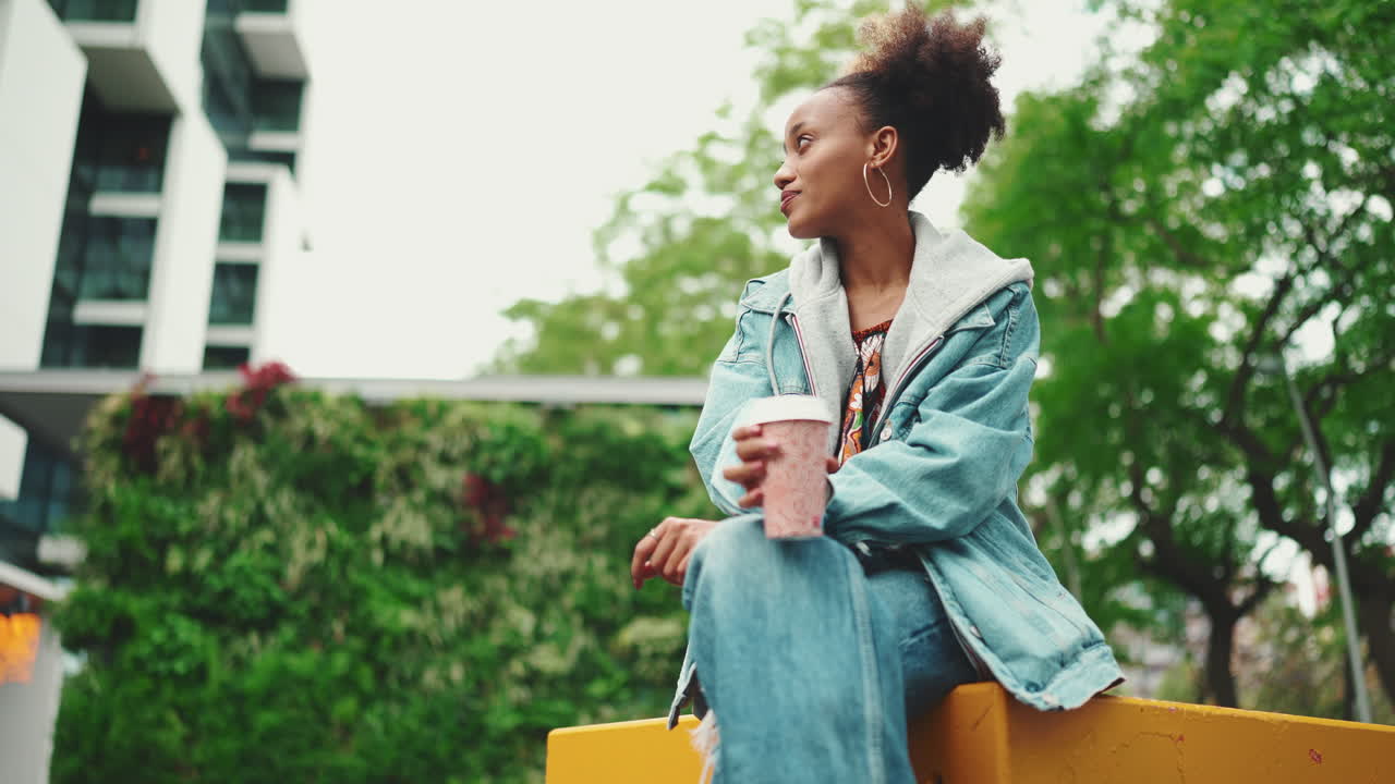 Woman drinking coffee in the city