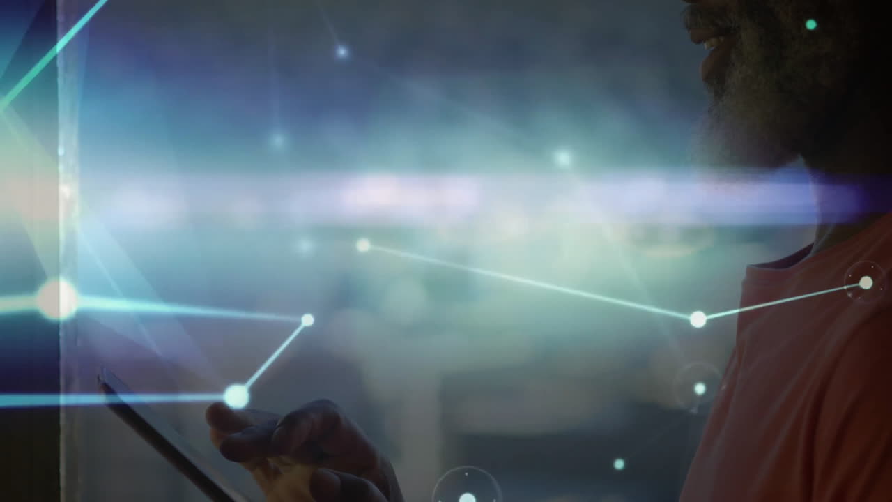 Using tablet with digital network connections overlay, person focused and engaged