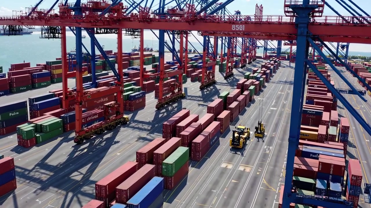 Aerial View of Busy Container Terminal with Cranes and Cargo