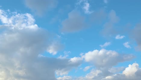 slow-motion clouds on a blue sky