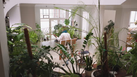 woman artist painting in a studio