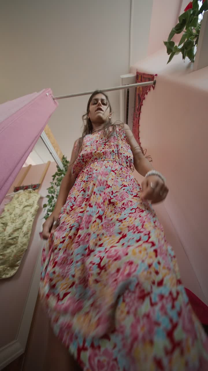 A woman in a floral dress in a changing room