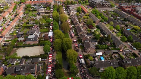 King's-Day-Annual-Event-With-Crowded-People-And-Flea-Market-In-Amsterdam,-Holland,-Netherlands