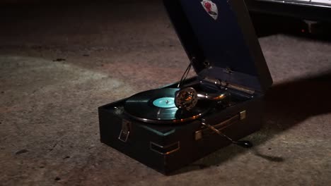 vintage record player on the ground at night