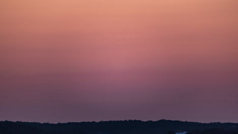 timelapse of a rocket launching in to space from a distance at sunset