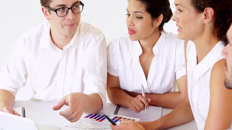 Business-people-having-a-meeting-at-desk