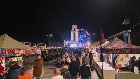 night market with ferris wheel and food stalls