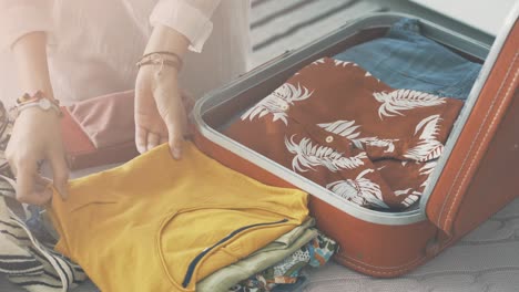 woman preparing summer luggage