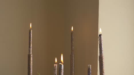 the candles is ready for a wedding day to be put in front of the groom while everyone is dancing in front of him