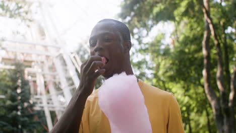 Young-man-eating-candy-floss