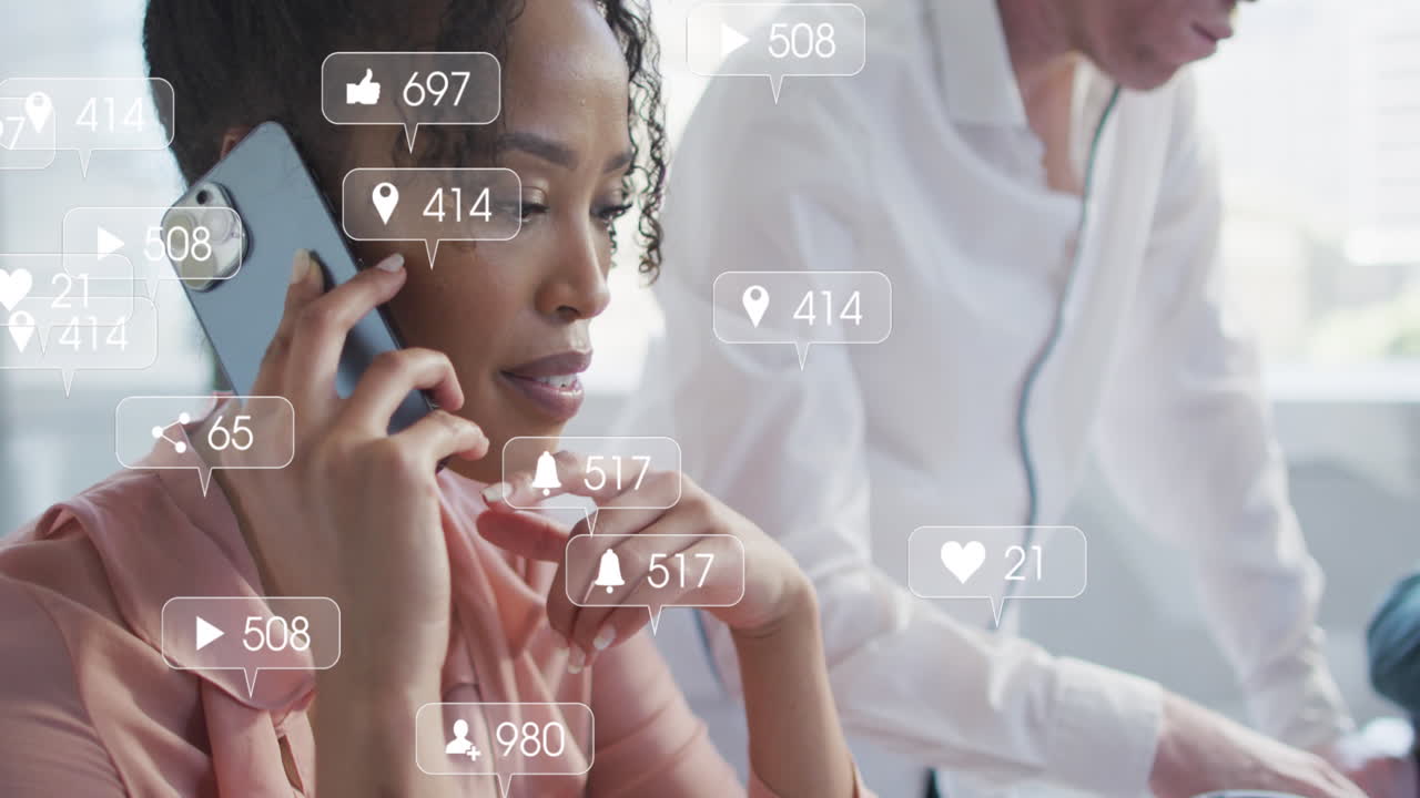 Animation of icons and data processing over biracial businesswoman in office