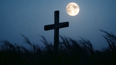 wooden cross under a full moon