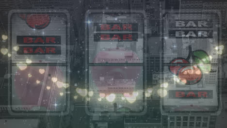 animation of fairy lights over casino slot machine against aerial view of cityscape