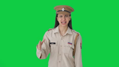 Angry-Indian-female-police-officer-shouting-on-someone-Green-screen