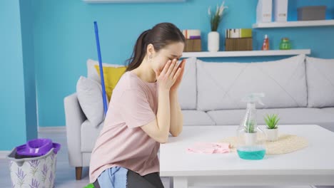 Emotional-asian-young-woman-crying-while-cleaning.