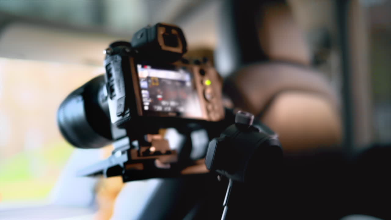 Close view of a camera filming display inside a car. Slow motion