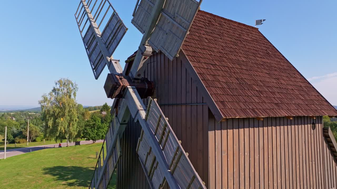 Drone scene of Borovnicky Mlyn windmill surrounded by golden fields