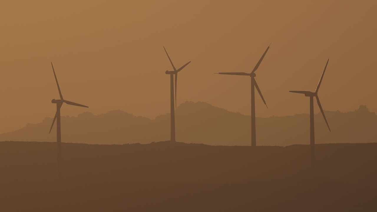 Wind turbines at sunset on the mountains