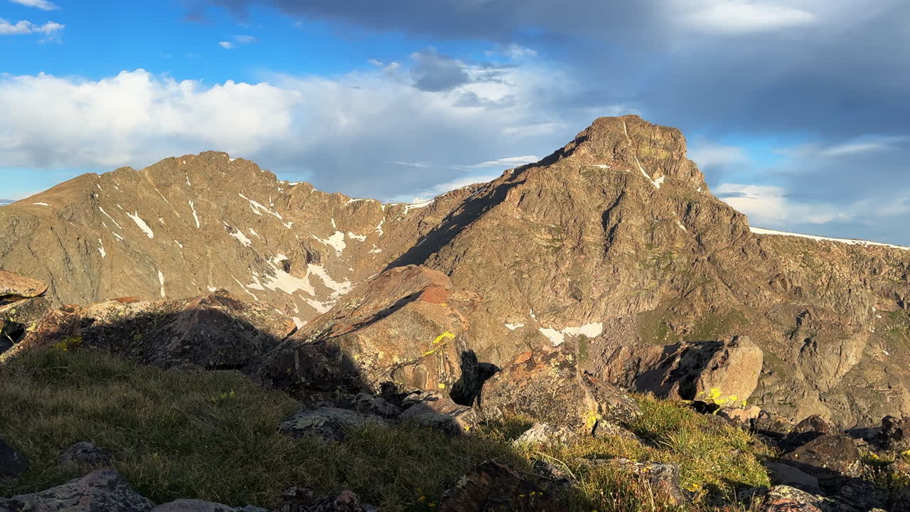 Mount of the Holy Cross 14er peak view from Halo Ridge Notch Mountain shelter spring summer Rocky Mountains Colorado blue sky clouds landscape nature summit snow field cornice pan right
