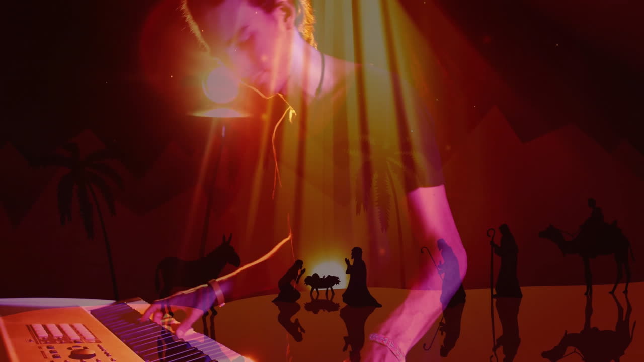 musician playing electronic keyboard on concert stage, with animated nativity silhouettes glowing