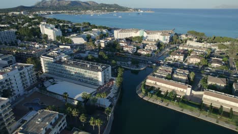 aerial circle pan video of seaside hotels in palma de mallorca, spain during sunny day in summer