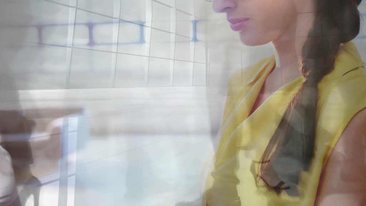 Animation of busy people walking over caucasian businesswoman in office