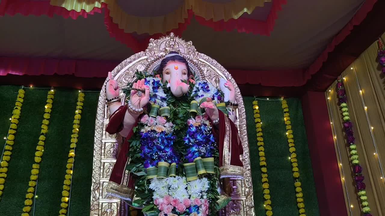 Beautiful Statue of Lord Ganesha Decorated with Flowers