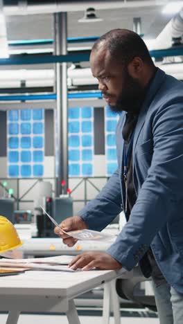 vertical video black master engineer reviews production line equipment for photovoltaics