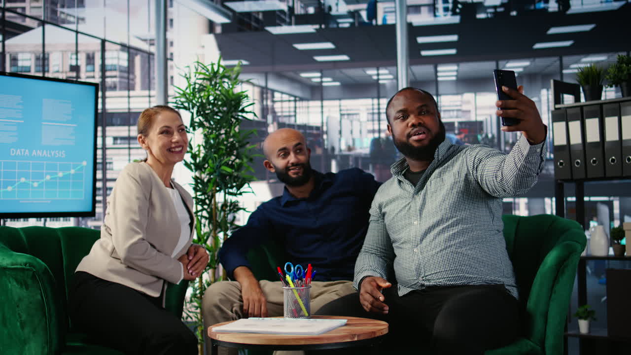 Vertical Video Multiethnic business people seal partnership with a picture on social media