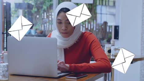 Woman-checking-her-emails-in-a-coffee-shop