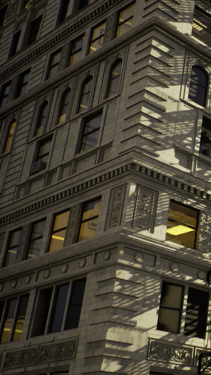 Building with detailed architecture and shadows in a city setting at dusk