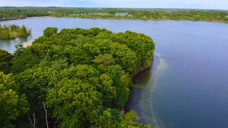 aerial view above scenic nature landscape in the countryside of breda, beautiful clear lake.