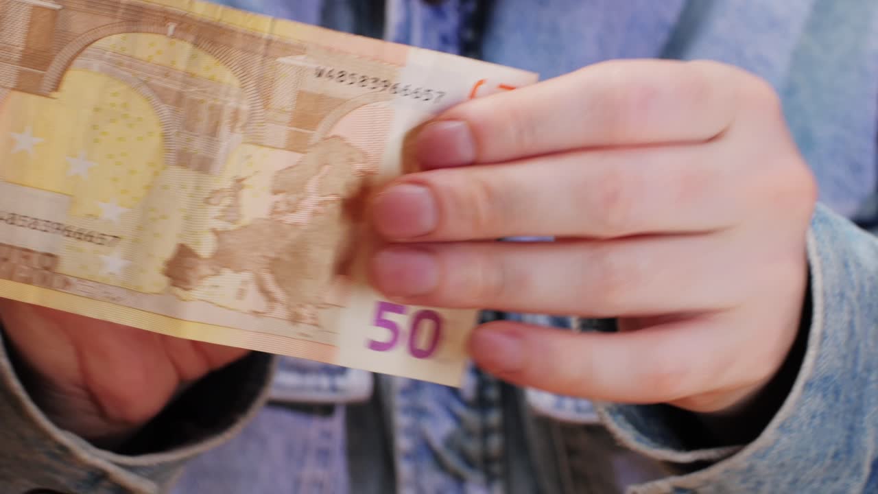 Fifty euro banknotes close-up. European currency EUR, EU Central Bank. 50 euro money macro. Economy, financial and banking concept in European union.