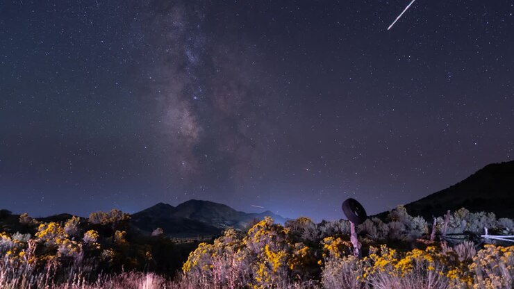 Twilight to nighttime Milky Way panning time lapse along an old fence in the Utah West Desert