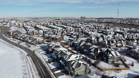 Aerial-view-of-a-suburban-community-at-sunset-in-Calgary,-Alberta-in-winter