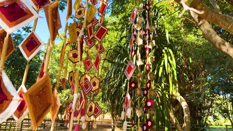 vibrant mobiles sway amidst lush greenery