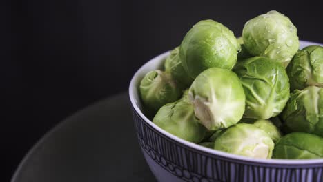 Extreme-Close-Up-of-Fresh-Brussel-Sprouts-rotating-on-black-background