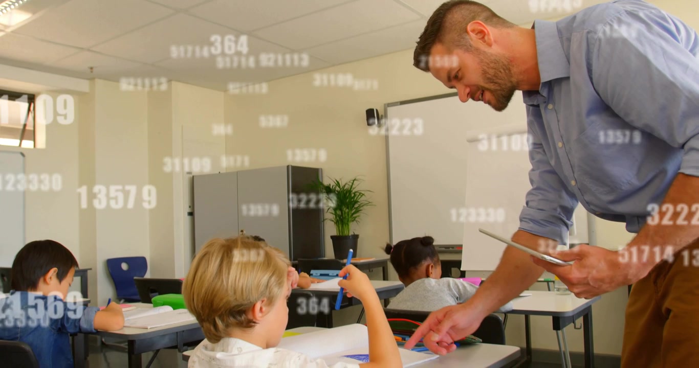 Teacher leaning over class as boy raising blue pen, pointing guiding with tablet floating overlay